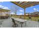 A great backyard deck with a dining space, hot tub, barbeque, and seating area at 11046 Timberview Dr, Fishers, IN 46037