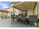 The spacious back deck features a hot tub, pergola, and seating area, perfect for outdoor entertaining at 11046 Timberview Dr, Fishers, IN 46037