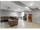 Finished basement with a comfortable couch and classic arcade games at 11046 Timberview Dr, Fishers, IN 46037
