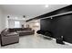 Finished basement with comfortable seating and arcade games at 11046 Timberview Dr, Fishers, IN 46037
