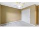 Bedroom featuring a ceiling fan, neutral carpet, and a closet at 11046 Timberview Dr, Fishers, IN 46037