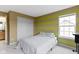 Bedroom with striped accent wall, carpet flooring, and closet at 11046 Timberview Dr, Fishers, IN 46037