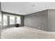Bright bonus room featuring soft carpet, a bay window, and ample space at 11046 Timberview Dr, Fishers, IN 46037