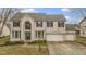 Charming two-story home with a three-car garage and brick exterior, enhanced by a well-manicured lawn at 11046 Timberview Dr, Fishers, IN 46037