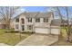 Charming two-story home with a three-car garage and brick exterior, enhanced by a well-manicured lawn at 11046 Timberview Dr, Fishers, IN 46037