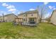 A nice house from the backyard featuring a deck with a hot tub and furniture at 11046 Timberview Dr, Fishers, IN 46037