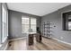 Well-lit home office features a modern desk, stylish shelving, and large windows at 11046 Timberview Dr, Fishers, IN 46037