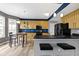 Bright kitchen featuring wooden cabinets, stainless steel appliances, and a dining area at 11046 Timberview Dr, Fishers, IN 46037
