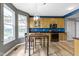Kitchen featuring a dining table with chairs, wooden cabinets, and stainless steel appliances at 11046 Timberview Dr, Fishers, IN 46037