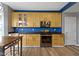 Bright kitchen featuring wooden cabinets, stainless steel appliances, and hardwood floors at 11046 Timberview Dr, Fishers, IN 46037