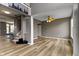 Spacious living room boasts an open layout with stairs, neutral walls, and contemporary flooring at 11046 Timberview Dr, Fishers, IN 46037