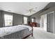 Light-filled main bedroom with cozy carpet, ceiling fan, and ample space at 11046 Timberview Dr, Fishers, IN 46037