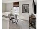 Cozy upstairs sitting area features comfortable chairs, a window with a view, and contemporary decor, ideal for relaxing at 11812 Vale St, Indianapolis, IN 46235