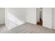 Bright carpeted bedroom featuring an open closet and an open doorway at 1255 Thornwood Dr, Greenwood, IN 46143