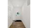 Bright hallway with wood flooring leads to the front door with large glass window at 1255 Thornwood Dr, Greenwood, IN 46143