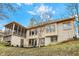 Backyard featuring a brick exterior with manicured landscaping and mature trees at 12618 E 86Th St, Indianapolis, IN 46236