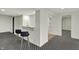 Finished basement with bar seating, white walls, and gray patterned carpet at 12618 E 86Th St, Indianapolis, IN 46236