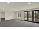 Bright basement featuring neutral walls, recessed lighting, and access to an outdoor patio at 12618 E 86Th St, Indianapolis, IN 46236