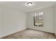 Neutral bedroom featuring a view of nature through the window at 12618 E 86Th St, Indianapolis, IN 46236