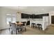 Dining area has wooden table, seating for four, and connects to the kitchen with white cabinets and appliances at 12618 E 86Th St, Indianapolis, IN 46236