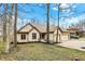 Charming brick home featuring an attached two car garage and a spacious front yard at 12618 E 86Th St, Indianapolis, IN 46236