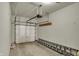 Well-lit garage featuring a white door and space for parking and storage at 12618 E 86Th St, Indianapolis, IN 46236