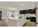 Spacious kitchen has a center island and stainless steel appliances that flows into the dining area at 12618 E 86Th St, Indianapolis, IN 46236