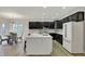 Modern kitchen featuring an island with sink, and dark cabinetry at 12618 E 86Th St, Indianapolis, IN 46236