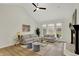Spacious living room with high ceilings, fireplace and comfortable seating arrangement at 12618 E 86Th St, Indianapolis, IN 46236