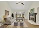 Inviting living room featuring vaulted ceilings, a cozy fireplace, and ample natural light at 12618 E 86Th St, Indianapolis, IN 46236