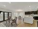 Well-lit living area adjacent to a contemporary kitchen and dining space at 12618 E 86Th St, Indianapolis, IN 46236