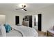 Well-appointed main bedroom features a luxurious bed, modern dresser, and easy access to ensuite bathroom at 12618 E 86Th St, Indianapolis, IN 46236