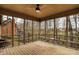 Spacious screened porch with a ceiling fan offers an ideal outdoor retreat with scenic views at 12618 E 86Th St, Indianapolis, IN 46236