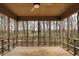 Charming screened porch provides a peaceful escape with views of the lush landscape and wooded surroundings at 12618 E 86Th St, Indianapolis, IN 46236
