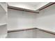 Well-organized walk-in closet providing plentiful storage options with shelves and rods at 12618 E 86Th St, Indianapolis, IN 46236