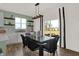 Chic dining area features a modern table, stylish chairs, and sliding doors to the outdoor space at 1281 Sika Ln, Greenwood, IN 46143