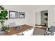 Comfortable study with a desk, two chairs, and a view into the entryway at 1281 Sika Ln, Greenwood, IN 46143