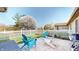 Outdoor stone patio with chairs and a view of the fenced yard at 1304 Vicksburg S Dr, Greenwood, IN 46143