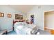 Cozy bedroom features soft blue walls, quaint decor, and a comfortable bed at 1304 Vicksburg S Dr, Greenwood, IN 46143