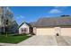 Charming home with a well-manicured lawn, spacious driveway, and attached two-car garage at 1304 Vicksburg S Dr, Greenwood, IN 46143