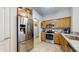Bright kitchen with stainless steel refrigerator and modern appliances, offering lots of counter space at 1304 Vicksburg S Dr, Greenwood, IN 46143