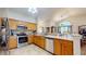 Bright kitchen with stainless steel appliances, tile backsplash, and granite countertops at 1304 Vicksburg S Dr, Greenwood, IN 46143