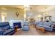 Open-concept living area with a fireplace and views into the kitchen and study at 1304 Vicksburg S Dr, Greenwood, IN 46143