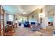 Bright living room with cozy armchairs, a fireplace, and beautiful natural light at 1304 Vicksburg S Dr, Greenwood, IN 46143