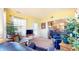 Sunny sunroom with neutral decor, ample seating, and view to living space at 1304 Vicksburg S Dr, Greenwood, IN 46143
