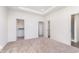 Spacious bedroom with tray ceiling, multiple closets, and access to an ensuite bathroom at 14539 Hanford Ln, Carmel, IN 46032