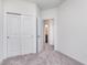 Bedroom with plush carpet, closet with sliding doors, and ensuite bathroom access at 14539 Hanford Ln, Carmel, IN 46032