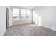 Bright bedroom with three large windows providing ample natural light and outdoor views at 14539 Hanford Ln, Carmel, IN 46032