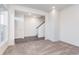 Inviting entryway featuring a staircase, coat closet, and a mix of carpet and vinyl flooring at 14539 Hanford Ln, Carmel, IN 46032