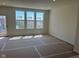 Bright living room area featuring large windows that flood the space with natural light at 14539 Hanford Ln, Carmel, IN 46032
